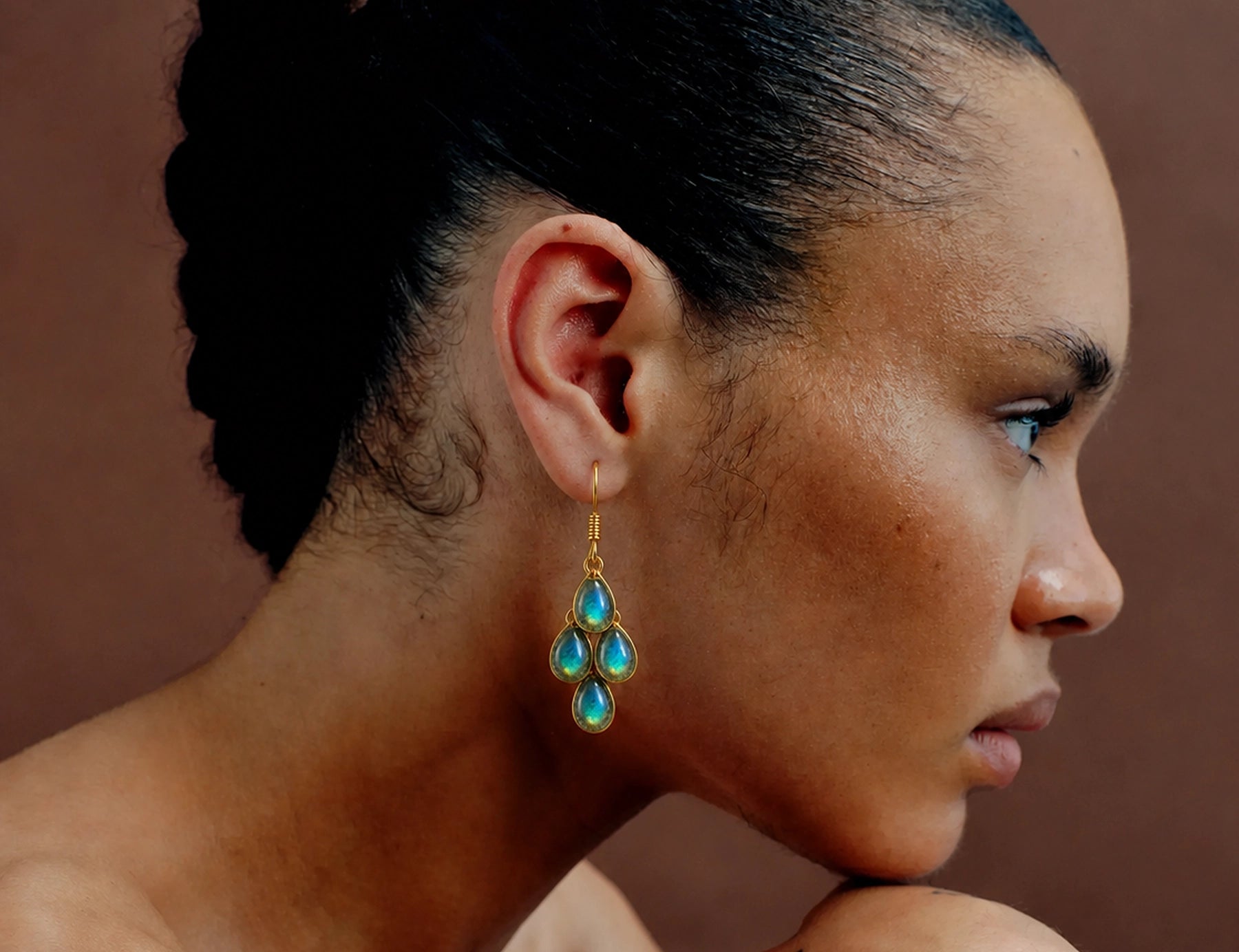 Woman wearing Drunk Angel crystal earrings