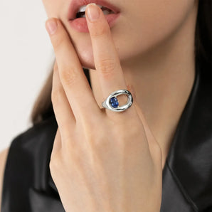 Oval Blue Sapphire Embrace Ring - Enfolding Arch 925 Sterling Model Shot
